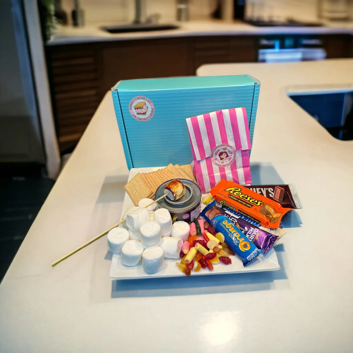Open Annie’s s’mores kit on a kitchen worktop with marshmallows, biscuits and chocolate for a family s’mores night